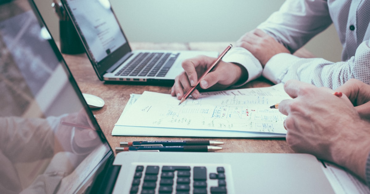 Business documents and laptop on a desk for official translation